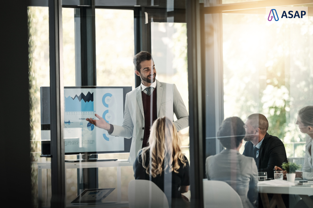 ASAP_a male admin goes over wage trends in a meeting